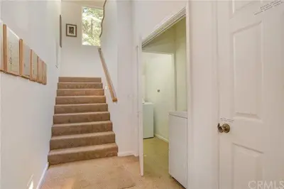 a hallway with a staircase in a house at Pine Arbor Retreat in Yosemite West