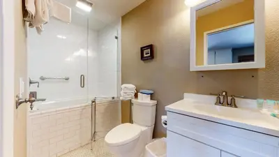 a bathroom with a sink and a toilet and a tub at La Vista Blanc #61 Condo in Mammoth Lakes