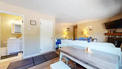 a living room with a couch and a table at La Vista Blanc #61 Condo in Mammoth Lakes