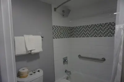 a bathroom with a tub and a toilet and a shower at Thunderbird Motel in Bishop