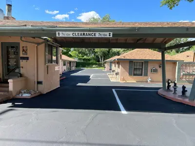 a parking lot with a sign that reads star healthcare plaza at Bishop Elms Motel in Bishop