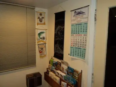 a room with a wall with a calendar on the wall at Bishop Elms Motel in Bishop
