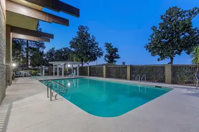 a swimming pool in the middle of a patio at Best Western Orchard Inn in Turlock