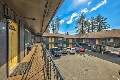 an aerial view of a building with cars parked in a parking lot at Lake Ridge South Lake Tahoe in South Lake Tahoe