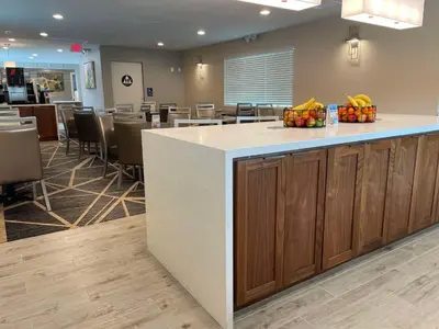 a waiting room with a counter with fruit on it at Best Western Town House Lodge in Modesto