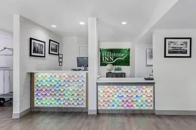 a room with a wall with a colorful display at Hillstone Inn Tulare, an Ascend Collection Hotel in Tulare