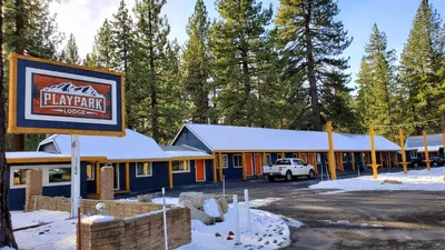 a building with a sign in front of it at Playpark Lodge in South Lake Tahoe