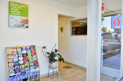 a sign on the wall of a store at Motel 6 - Santa Nella, on i-5 in Santa Nella Village