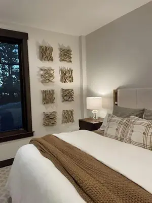 a white bedroom with a bed and a window at Gondola Lodge & Tahoe Beach Club in South Lake Tahoe