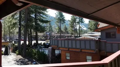 a view from the balcony of a house with a mountain at Gondola Lodge & Tahoe Beach Club in South Lake Tahoe