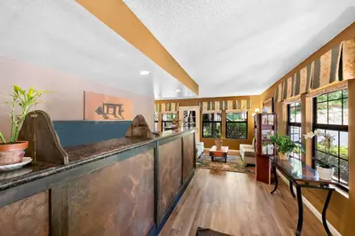 a large room with a bar in a house at Best Western Stagecoach Inn in Pollock Pines
