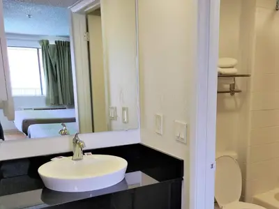 a bathroom with a sink and a mirror at Studio 6-Fresno, CA - Extended Stay in Pinedale