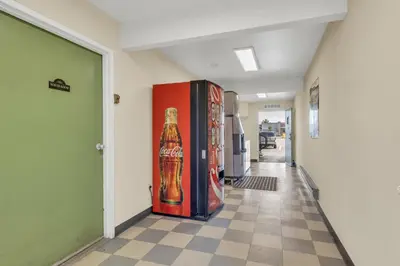 a hallway with two soda machines in a building at Days Inn by Wyndham Carson City in Carson City