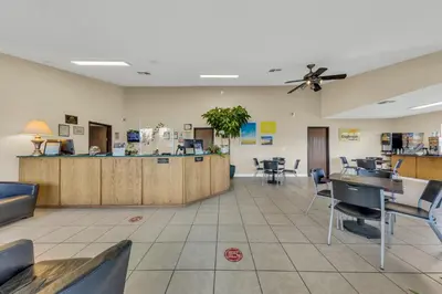 a waiting room at a restaurant with a ceiling fan at Days Inn by Wyndham Carson City in Carson City