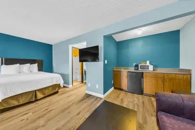 a hotel room with a bed and a tv at Days Inn by Wyndham Carson City in Carson City
