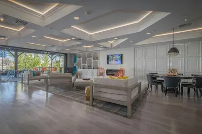 a living room with couches and a dining room at Renaissance Reno Downtown Hotel & Spa in Reno