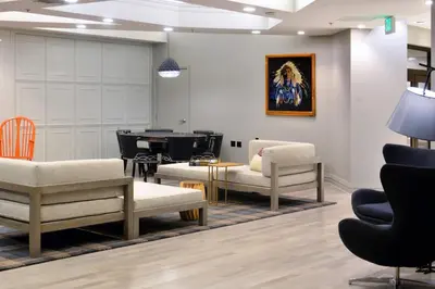 a waiting room with chairs and a table at Renaissance Reno Downtown Hotel & Spa in Reno