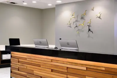 a lobby with two laptops and birds on the wall at Renaissance Reno Downtown Hotel & Spa in Reno