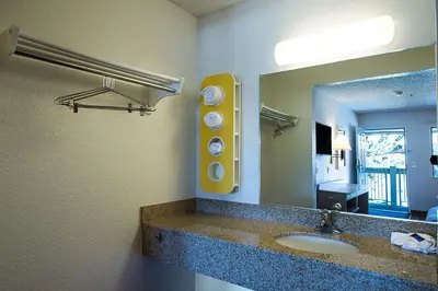 a bathroom with a sink and a mirror at Motel 6-Sparks, NV - Airport - Sparks in Reno