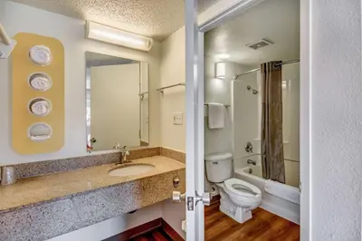 a bathroom with a toilet and a sink at Motel 6-Stockton, CA - North in Lincoln Village