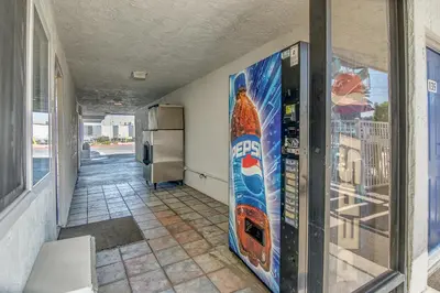 a wall with a skateboard on the side of a building at Motel 6-Stockton, CA - Charter Way West in Stockton