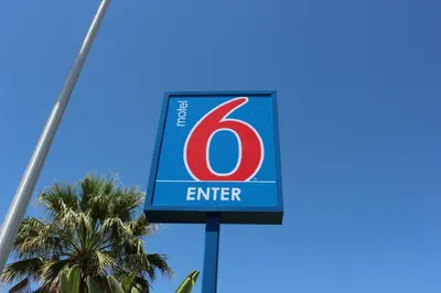 a sign with the number enter on it at Motel 6-Coalinga, CA - East in Coalinga