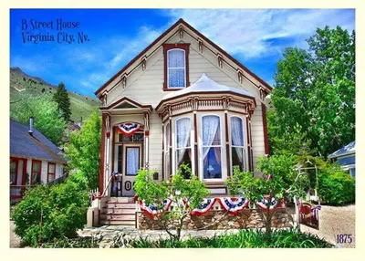a house with an american flag on the front of it at B Street House Inn in Virginia City