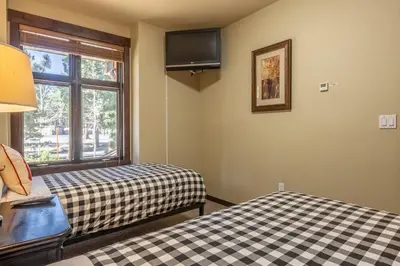 a room with two beds and a window at Solstice 6 in Mammoth Lakes