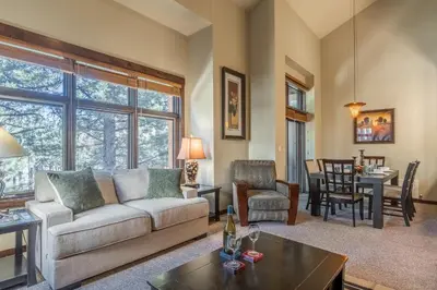 a living room with a couch and a table at Solstice 6 in Mammoth Lakes