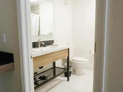 a bathroom with a sink and a toilet at Cedar Lodge in El Portal