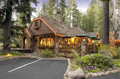 a large wooden house in the middle of a road at Cottage Inn At Lake Tahoe in Tahoe City