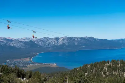 two people on a ski lift over a lake at Zalanta 328 - HVH3 in South Lake Tahoe