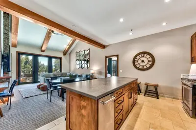 a kitchen and living room with a table and chairs at Zalanta 328 - HVH3 in South Lake Tahoe