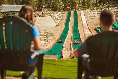 a group of people sitting in chairs looking at a fake track at Zalanta 317 in South Lake Tahoe