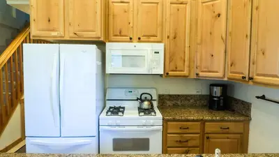 a kitchen with a white refrigerator and a stove at Ski Trails 4042 in Truckee