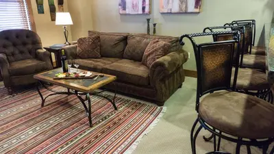 a living room with a couch and a table and chairs at Catamount 407C in Truckee