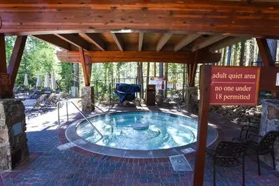 a hot tub in a pavilion with a sign at Ski Trails 4024 in Truckee