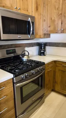 a kitchen with a stove and a microwave at Ski Trails 4070 in Truckee