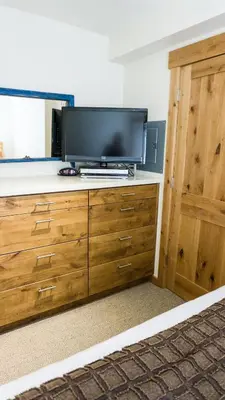 a television on a dresser in a room at Ski Trails 4070 in Truckee