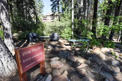 a sign in the middle of a park with a picnic table at Ski Trails 4058 in Truckee