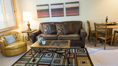 a living room with a couch and a table at Ski Trails 4113 in Truckee