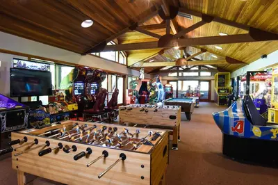 a room with several video games and a arcade at Ski Trails 4113 in Truckee