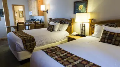 a hotel room with two beds and a kitchen at Northstar Village 216 in Truckee