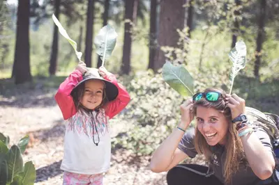 a woman and a little girl wearing leaves on their hats at Northstar Village 216 in Truckee