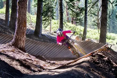a person on a bike jumping over a fence at Northstar Village 216 in Truckee