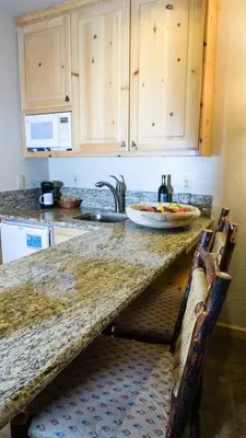 a kitchen with a counter top with a sink and a counter sidx sidx sidx at Northstar Village 216 in Truckee