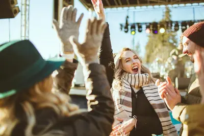 a group of people raising their hands in the air at Zalanta 221 in South Lake Tahoe