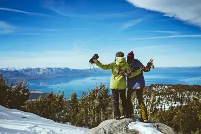 two people standing on top of a mountain in the snow at Zalanta 221 in South Lake Tahoe