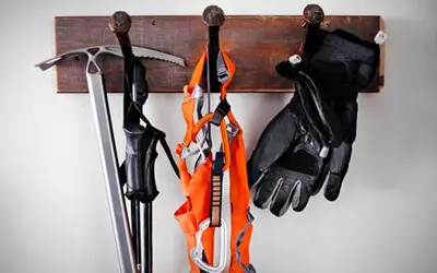 a group of tools hanging from a wooden rack at Basecamp Tahoe South in South Lake Tahoe