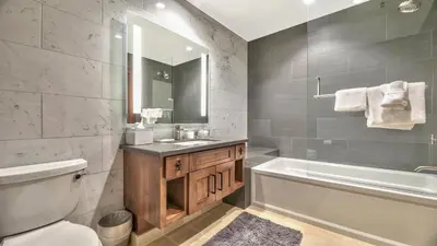 a bathroom with a tub and a sink and a toilet at Zalanta 313 in South Lake Tahoe